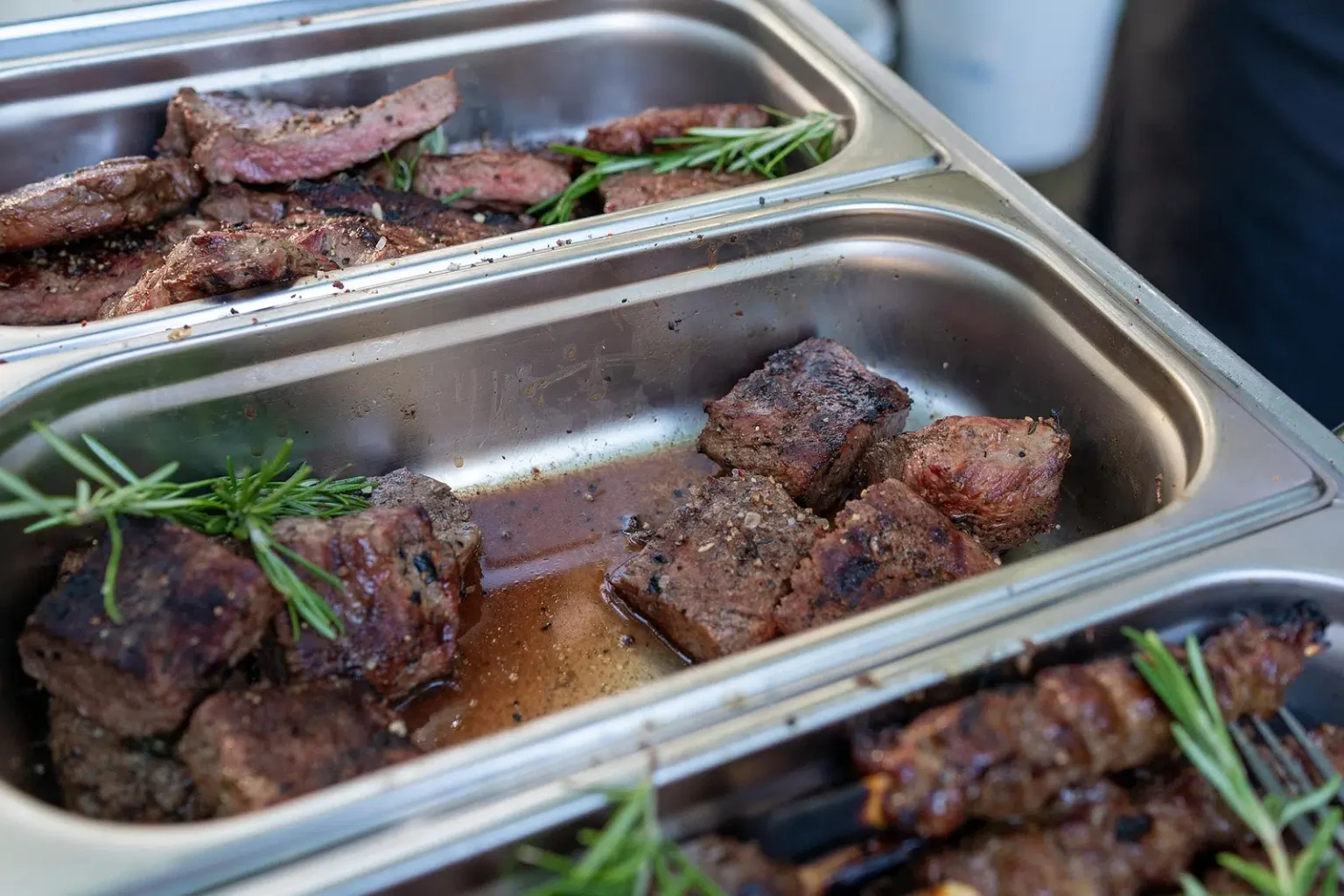Tender meat in a commercial severing tray, Catering Menu And Cuisine Options for Corporate Catering and Private Functions