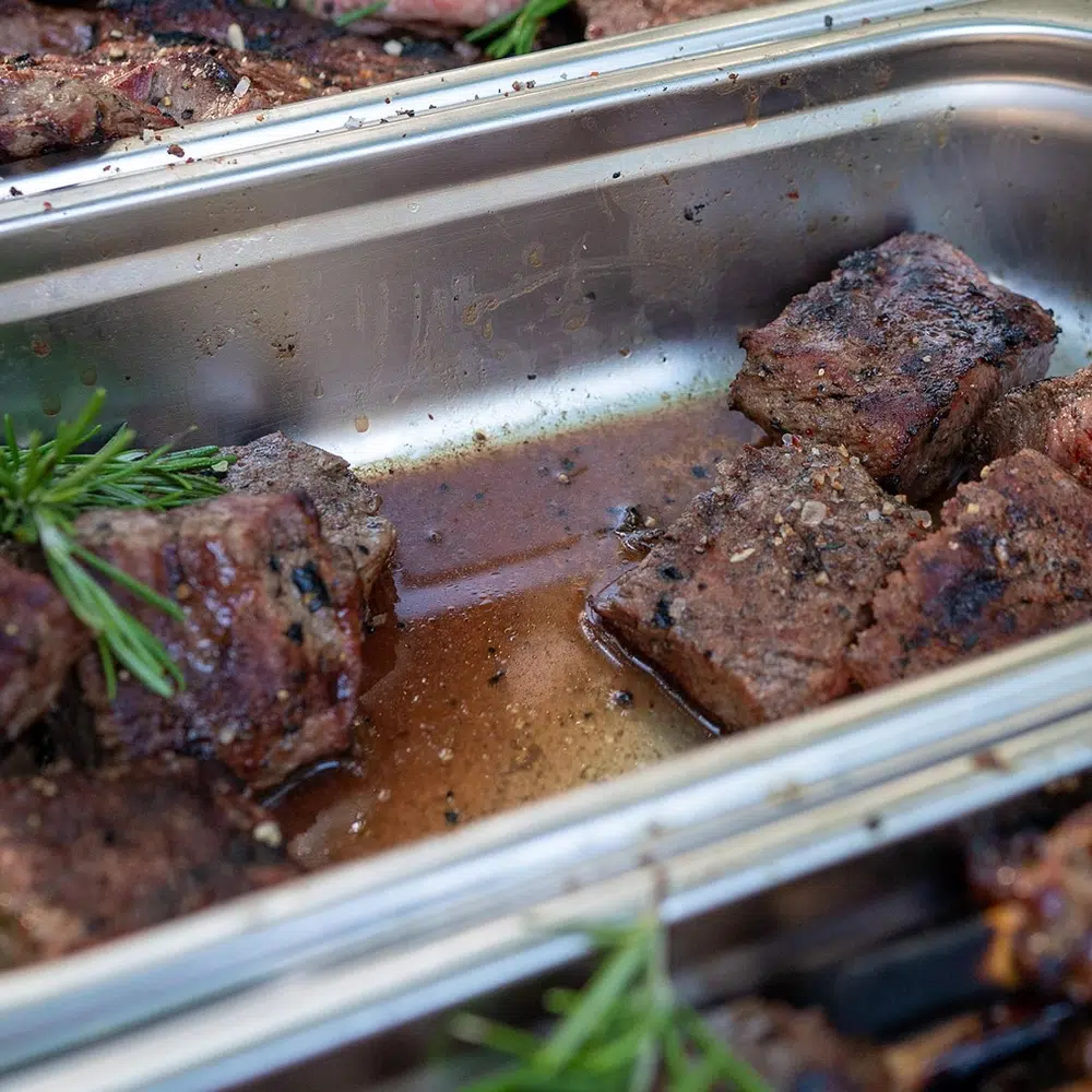 Tender meat in a commercial severing tray, Catering Menu And Cuisine Options for Corporate Catering and Private Functions