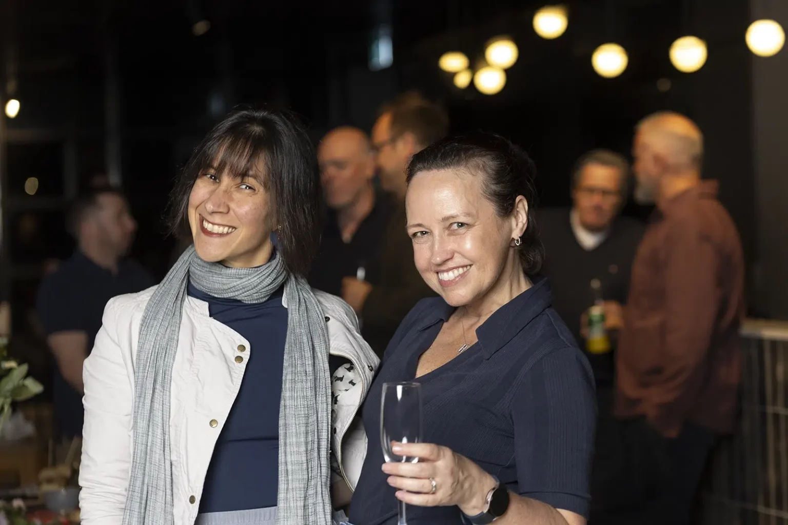 Ladies smiling and enjoying a friends' birthday party catering in Melbourne