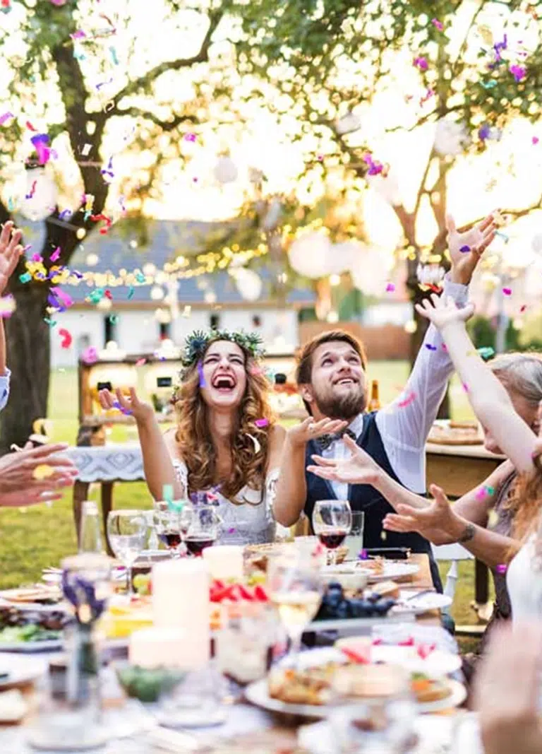 Newly Weds enjoy Bespoke Wedding Catering in Melbourne at an outside wedding arranged by White Knight Catering Services