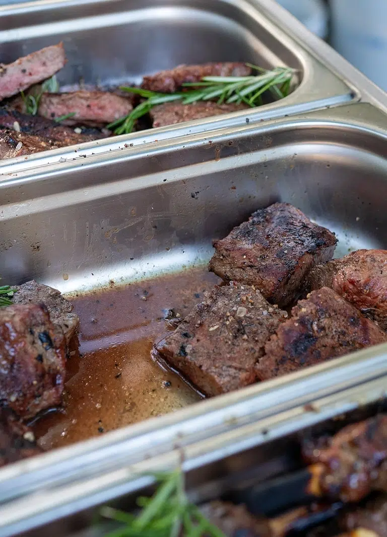 Tender meat in a commercial severing tray, Catering Menu And Cuisine Options for Corporate Catering and Private Functions