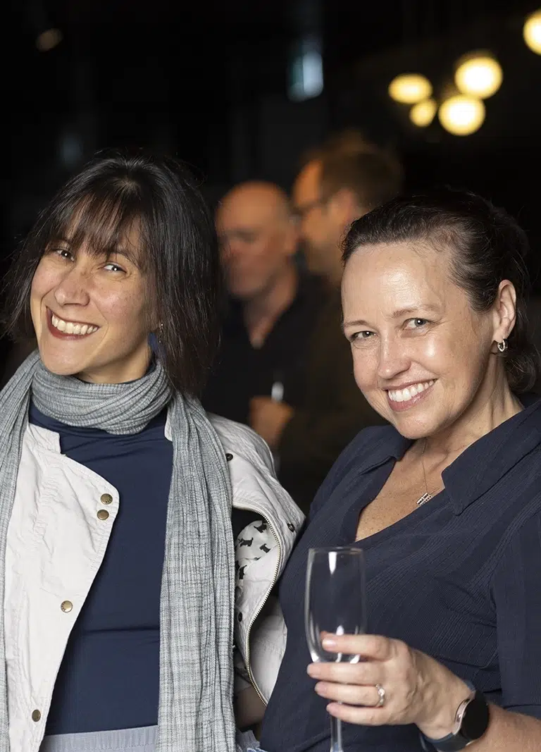 Ladies smiling and enjoying a friends' birthday party catering in Melbourne