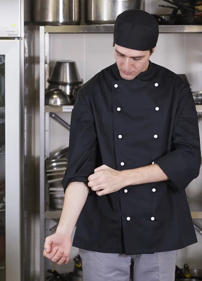 A Chef preparing for service as Reliable Operational And Business Catering Services in Melbourne