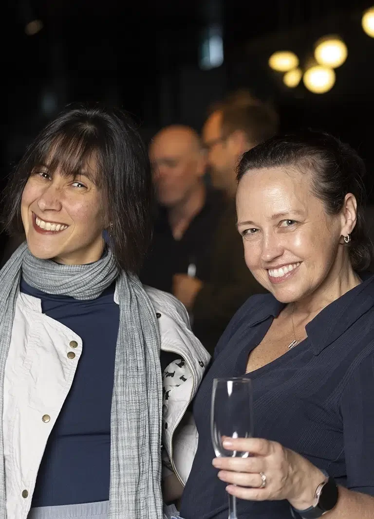 Ladies smiling and enjoying a friends' birthday party catering in Melbourne