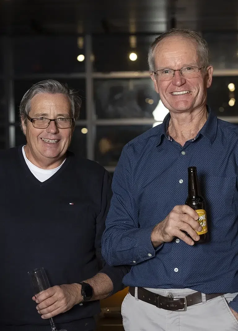 Two gentlemen enjoying drinks and Retirement Party Catering in Melbourne at a Private Function Room provide by White Knight Catering